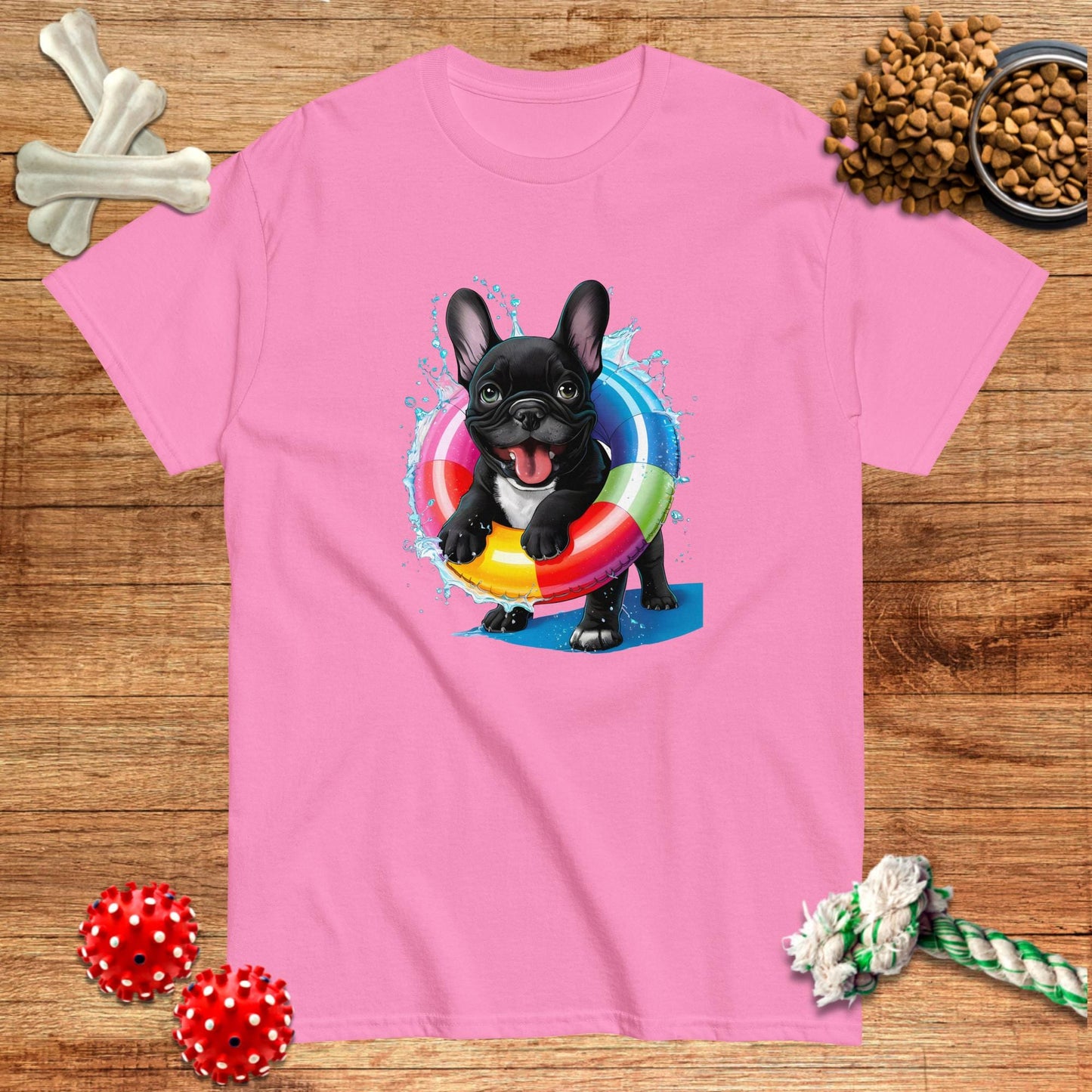 Pink t-shirt featuring a French Bulldog swimming with a colorful inner tube, from Pawsome Frenchie Designs.