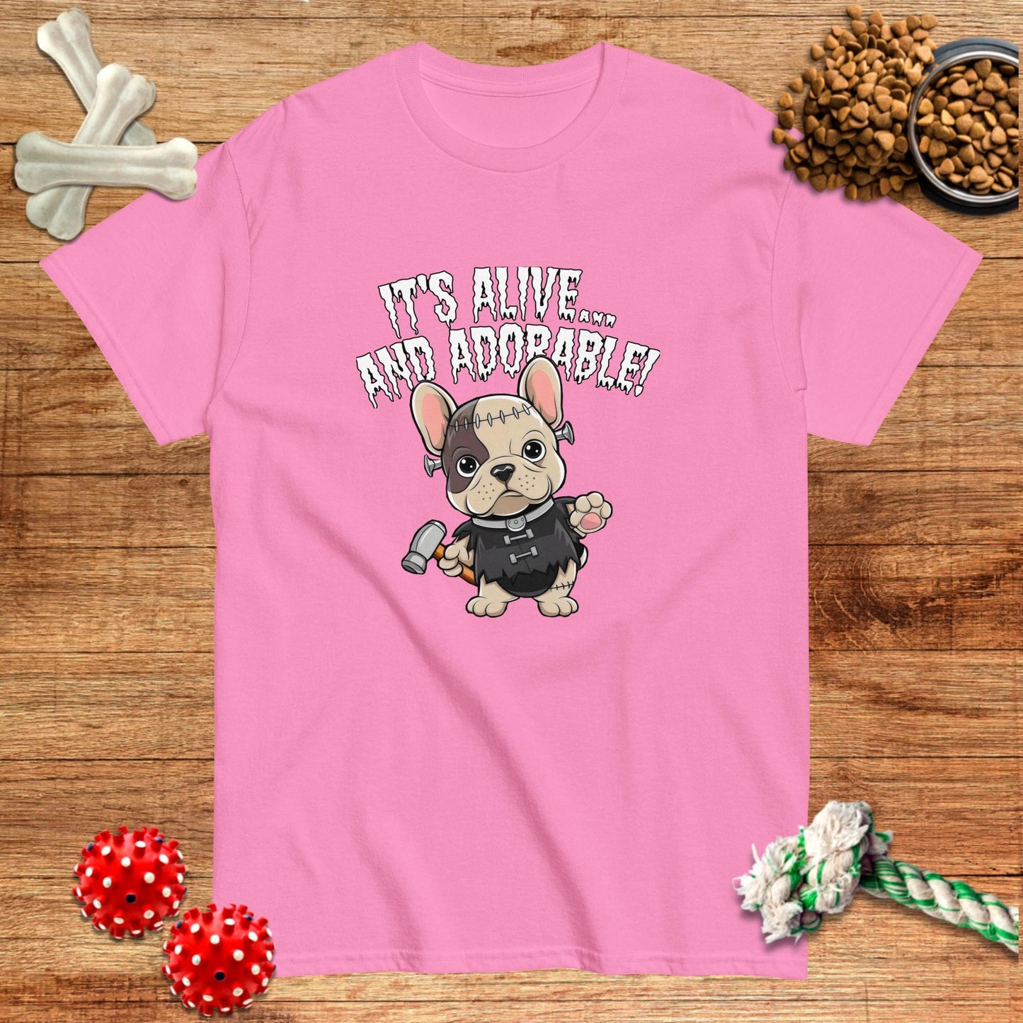 Pink Halloween t-shirt featuring a cartoon French Bulldog monster with the text "It's Alive... and Adorable!" by Pawsome Fre