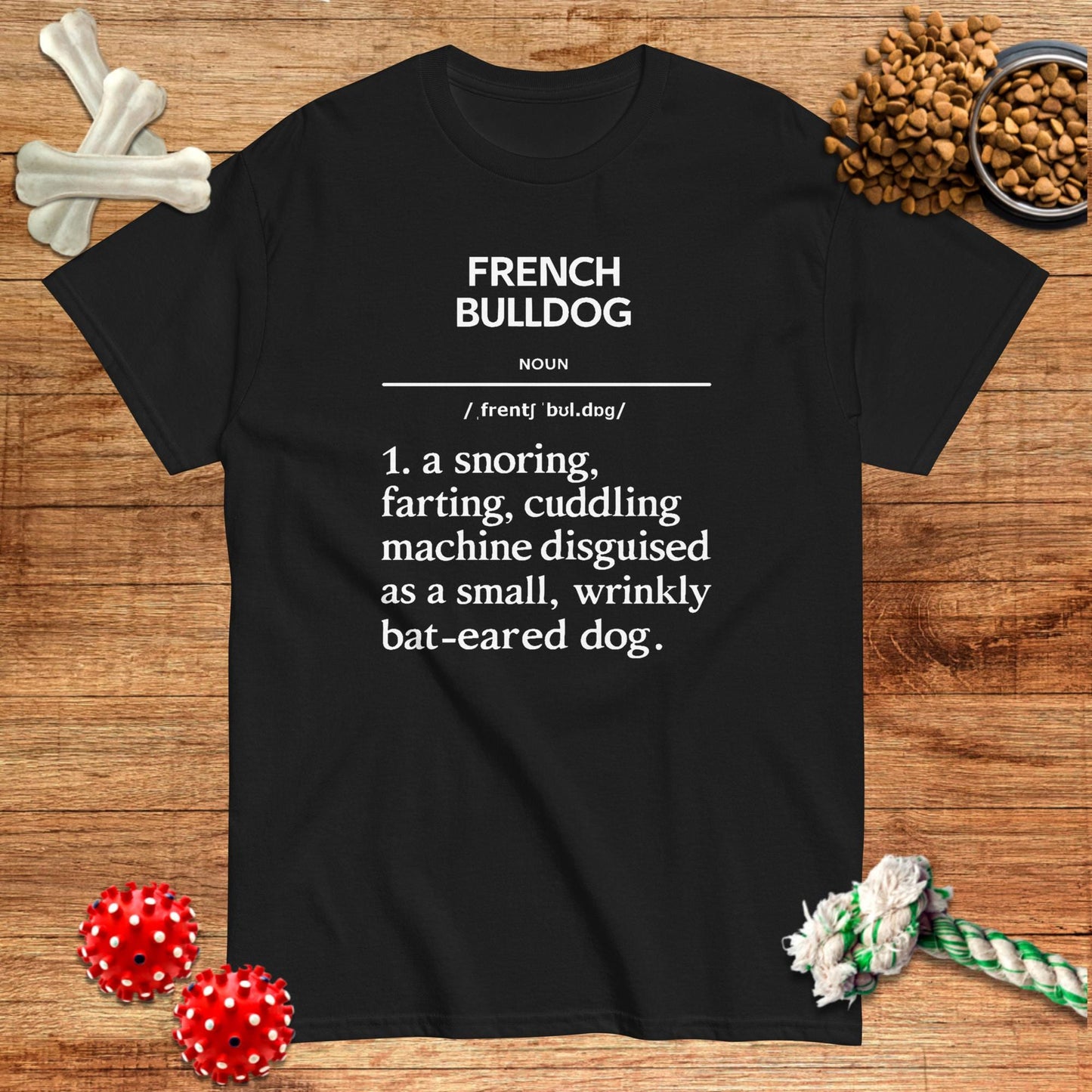Black t-shirt featuring a humorous definition of "French Bulldog" by Pawsome Frenchie Designs.