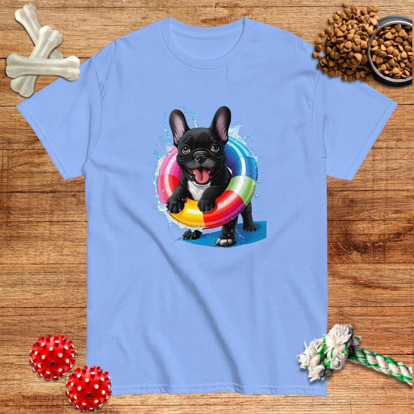 Light blue t-shirt featuring a French Bulldog swimming with a colorful inner tube by Pawsome Frenchie Designs