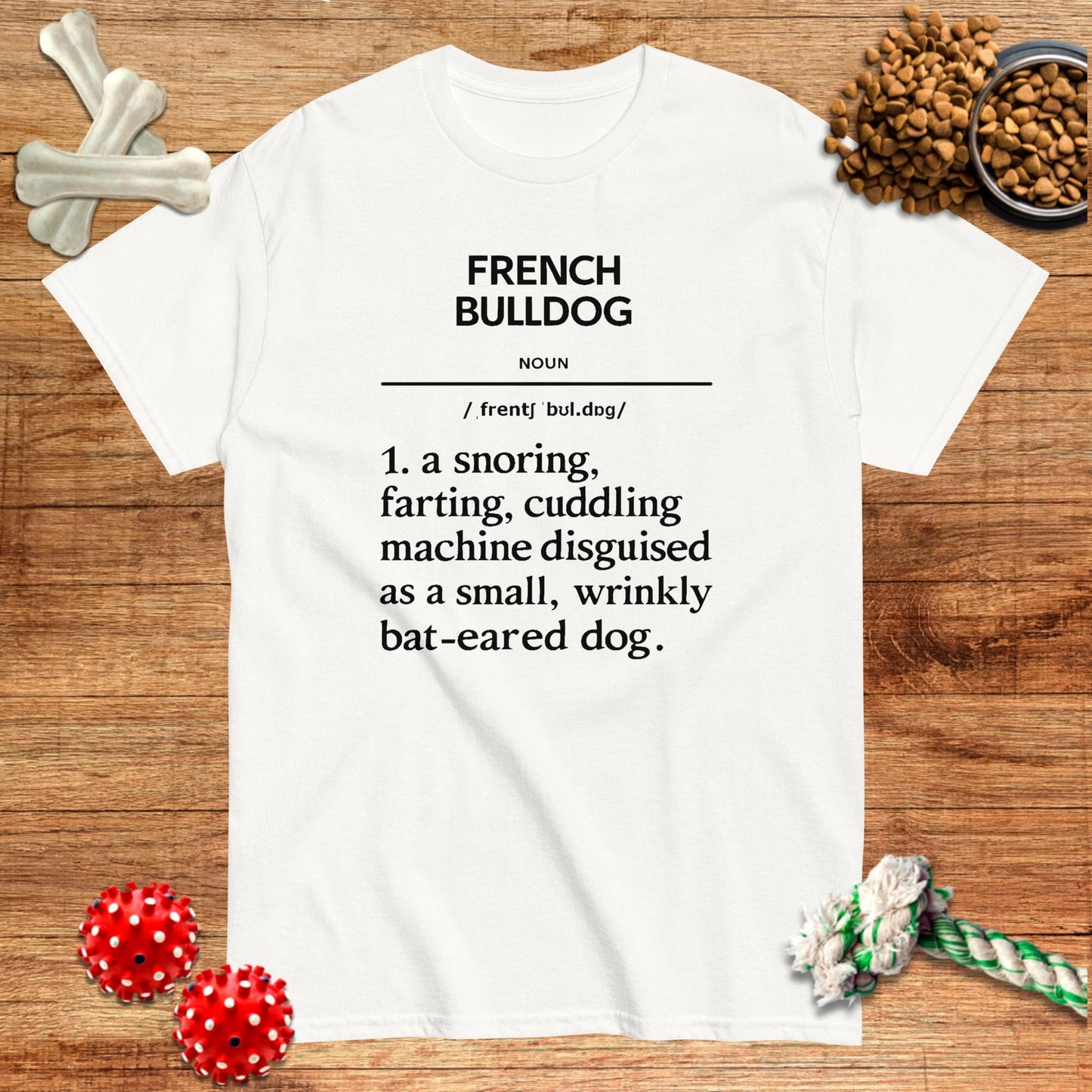 White t-shirt featuring a humorous definition of "French Bulldog" with black text, designed by Pawsome Frenchie Designs.
